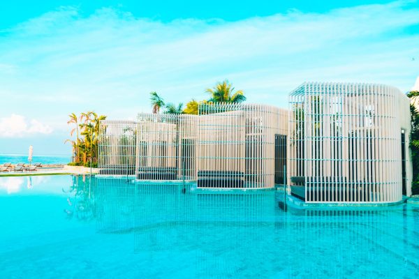 Beautiful luxury hotel swimming pool with umbrella and beach chair - Vintage Filter effect